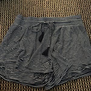 Stars above navy striped pajama shorts